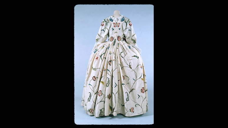 Women’s floral brocade dress with a large skirt and long sleeves, 1775–1777.