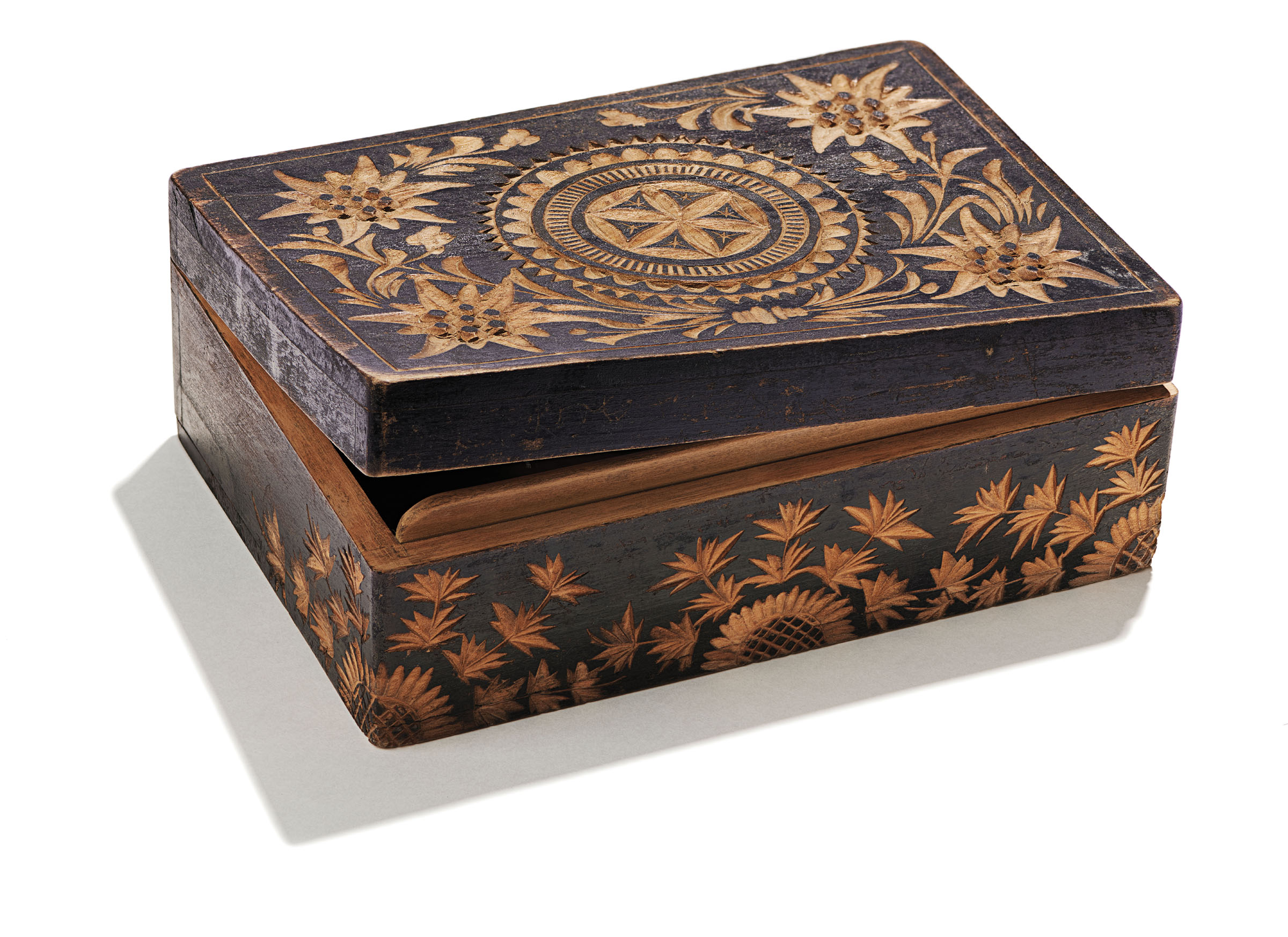 Wooden box decorated with floral and circular star-patterned inlays.