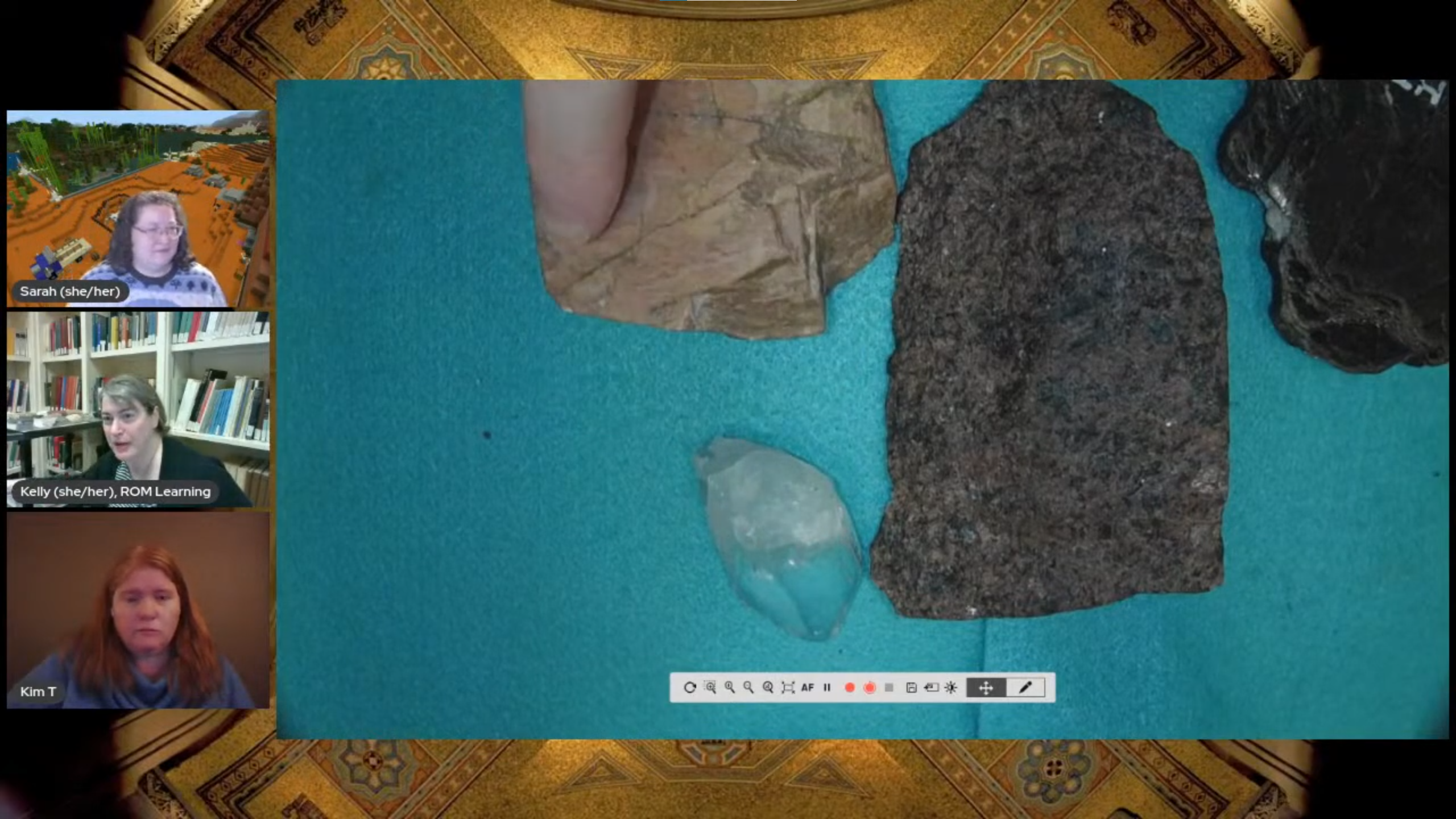 A desktop camera shows pieces of pink feldspar, black mica, white quartz, and granite containing a mix of those three colours.