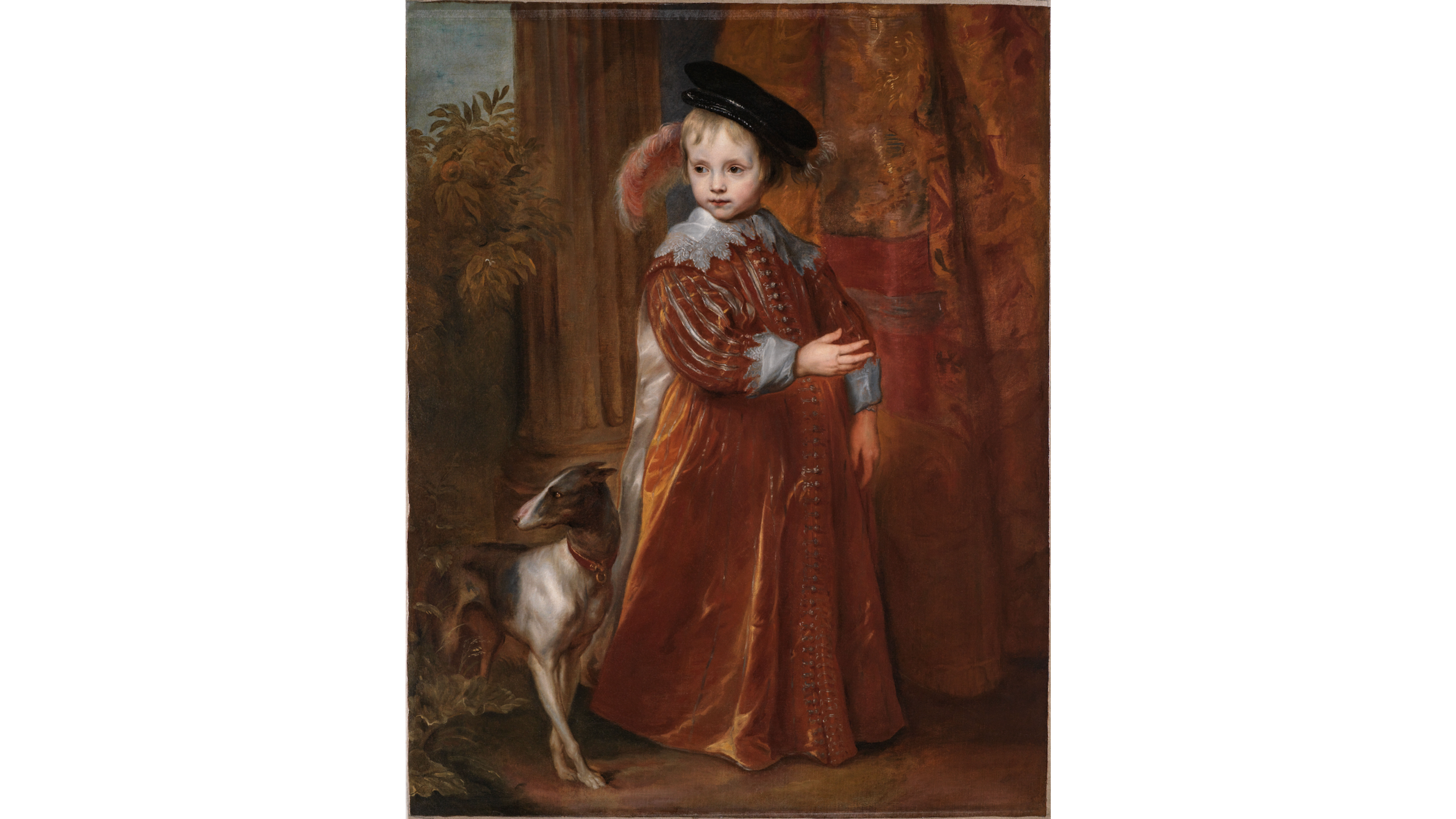 A young girl dressed in a long brown velvet dress with lace at the cuffs and collar, standing beside a dog.