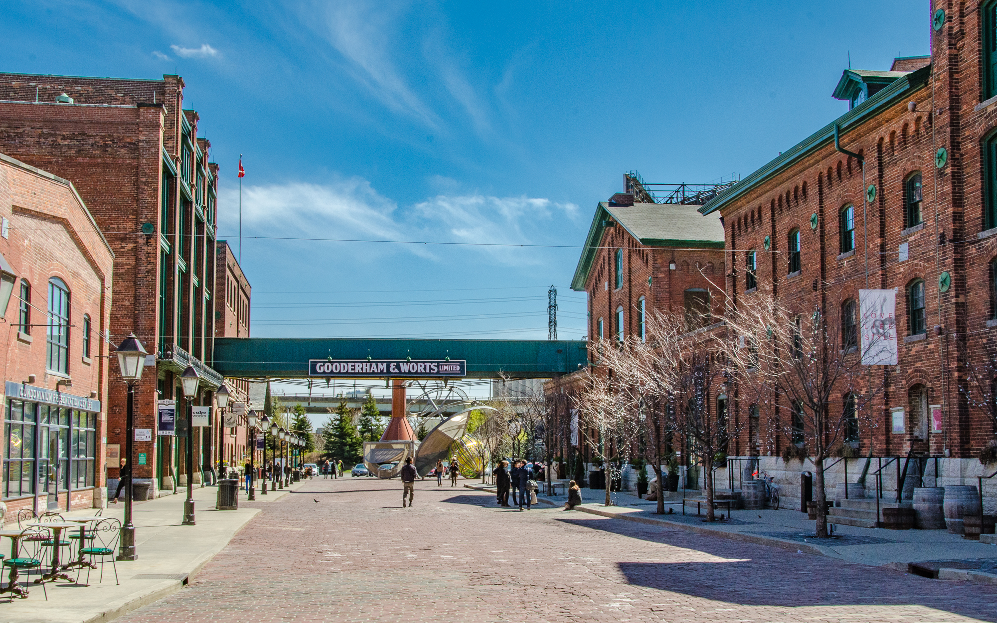 Street view of laneway with a building to the left and a building to the right