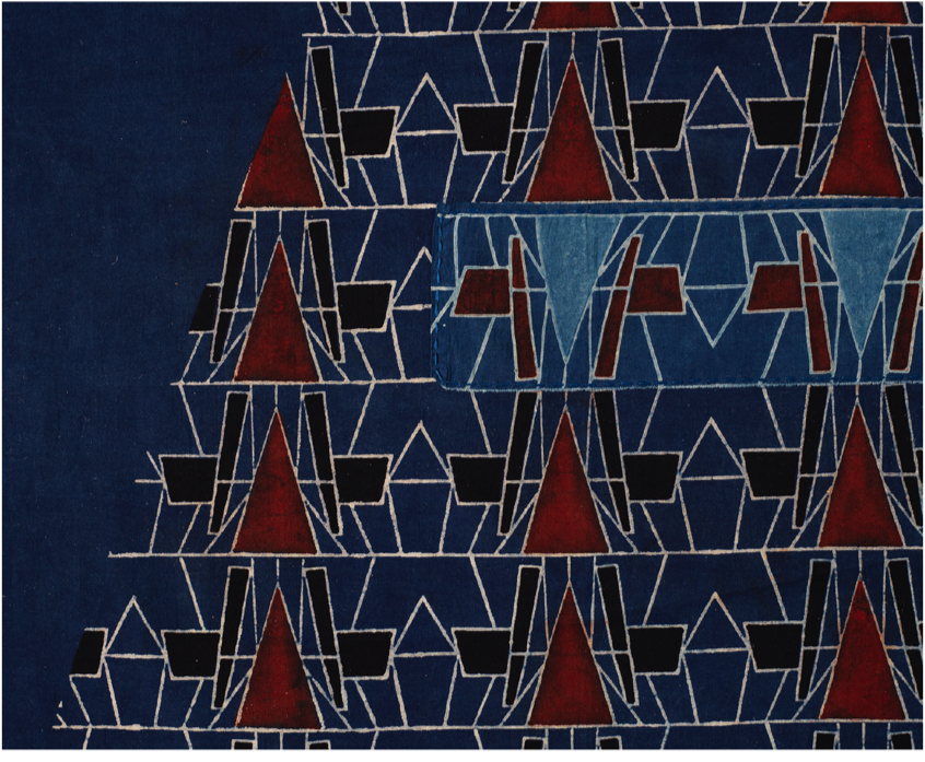 Abstract geometric pattern with dark blue, red, and black shapes forming a grid-like design.