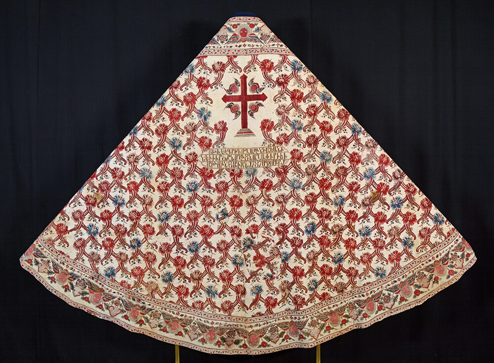 The back view of the completed cope on a display mount.
