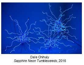 Blue background with two glowing, tangled neon rods resembling sea creatures.