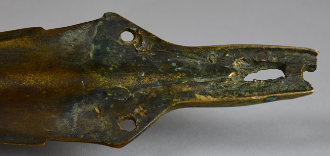 Bronze crocodile-shaped mouthpiece with detailed head and open jaws.
