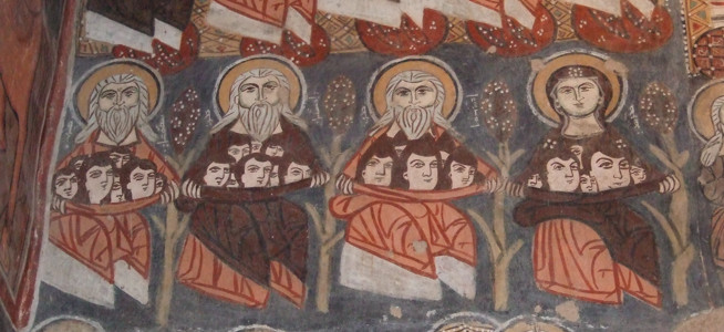 A colored mural depicting seven haloed religious figures holding books or scrolls.