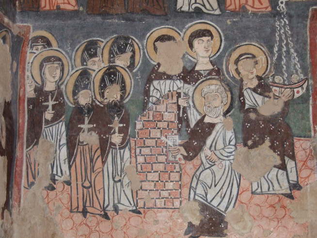 Medieval fresco showing a group of haloed figures, some with their hands raised in blessing or prayer.
