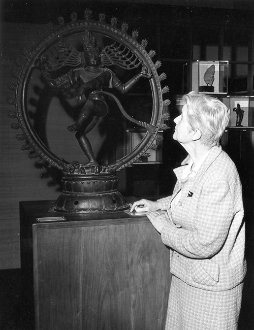 Ella Martin, joined ROM 1938 retired 1971 Sr. Lecturer in above department. Seen here in gallery looking at the God Siba.