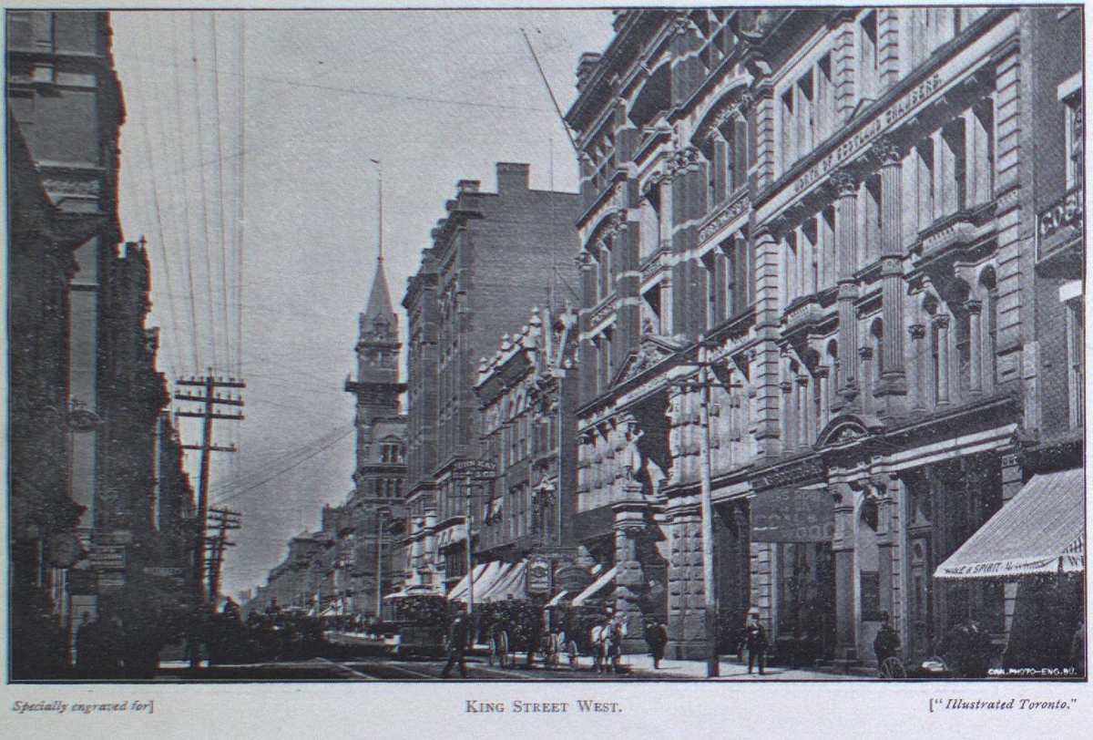 King Street West with buildings and a clock tower visible under a cloudy sky.