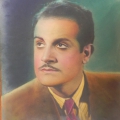 Portrait of a man with slicked-back dark hair, a thin mustache, wearing a brown suit jacket, white shirt, and patterned tie.