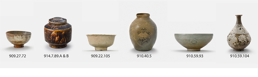 A horizontal row of six ceramic vessels, including jars and bowls, each with a unique shape and decoration, displayed on a white surface.