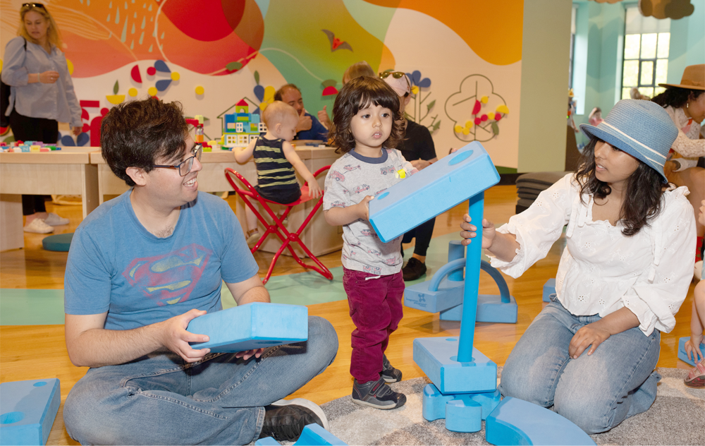 Family enjoying Member preview day at the ROM's WonderWorks Hands-on-Gallery