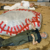ROM research technician Jacqueline Miller and Schad Gallery Coordinator Nicole Richards pose with the wrapped blue whale heart for scale.
