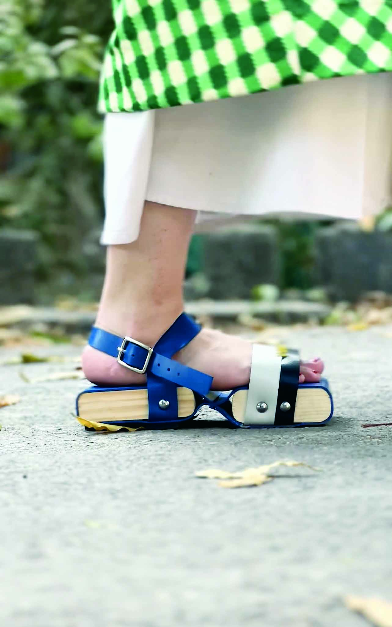 Person wearing blue sandal.