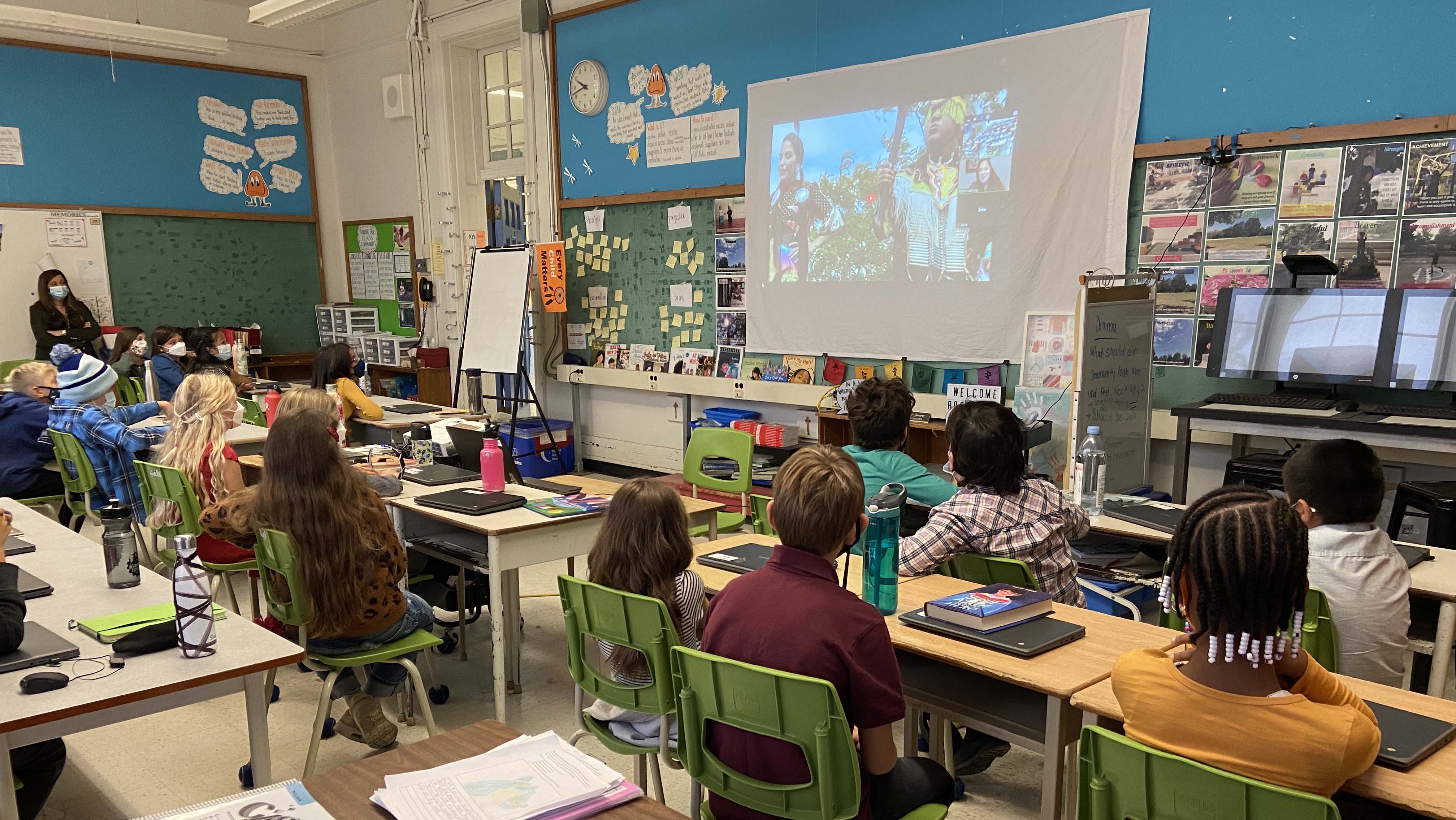 Leslie, pictured onscreen, teaches a class about Indigenous dance.