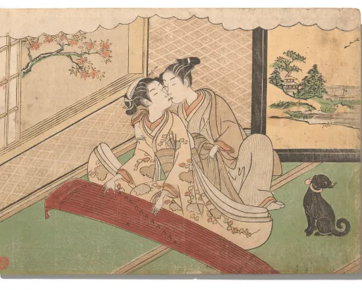 Two women in traditional Japanese clothing seated indoors on tatami mats, one playing a koto instrument, with a black cat nearby and a painted screen of a landscape behind.