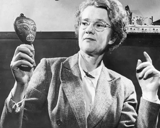 Ella Martin displays an artifact.