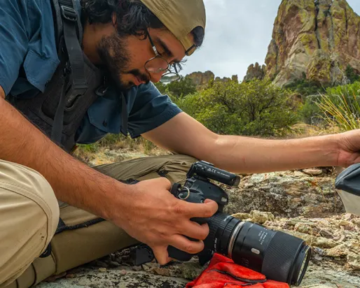 In the Chiricahua Mountains of Arizona, Nick Kanakis prepares to shoot a jumping spider. Photo credit: Javier Aznar.
