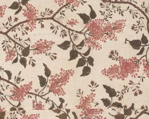 Floral fabric pattern with brown branches and leaves, and pink flower clusters on a beige background.