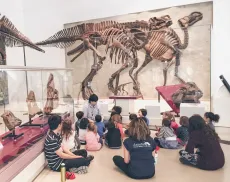 Johnson, a former volunteer an now instructors, teaches his 5 year old class about the Good Mother Lizard Maiasaura.