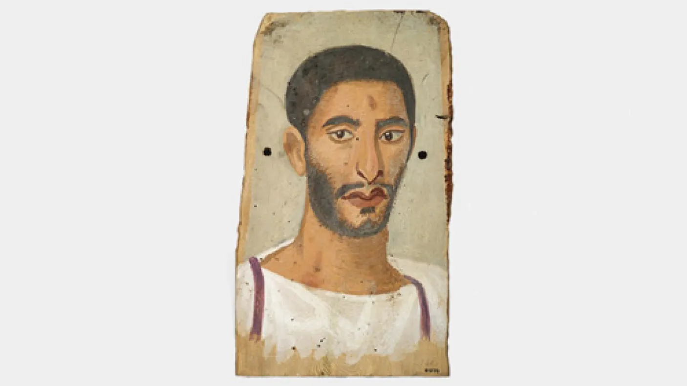 Portrait of a man with dark hair, beard, and mustache, wearing a white tunic with purple stripes on the edges.