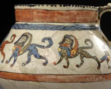 Ancient ceramic jar decorated with painted figures of animals and humans in motion around the body.