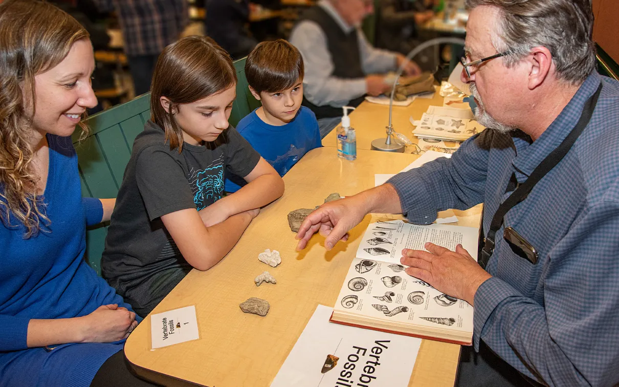 Professor educating students about rocks