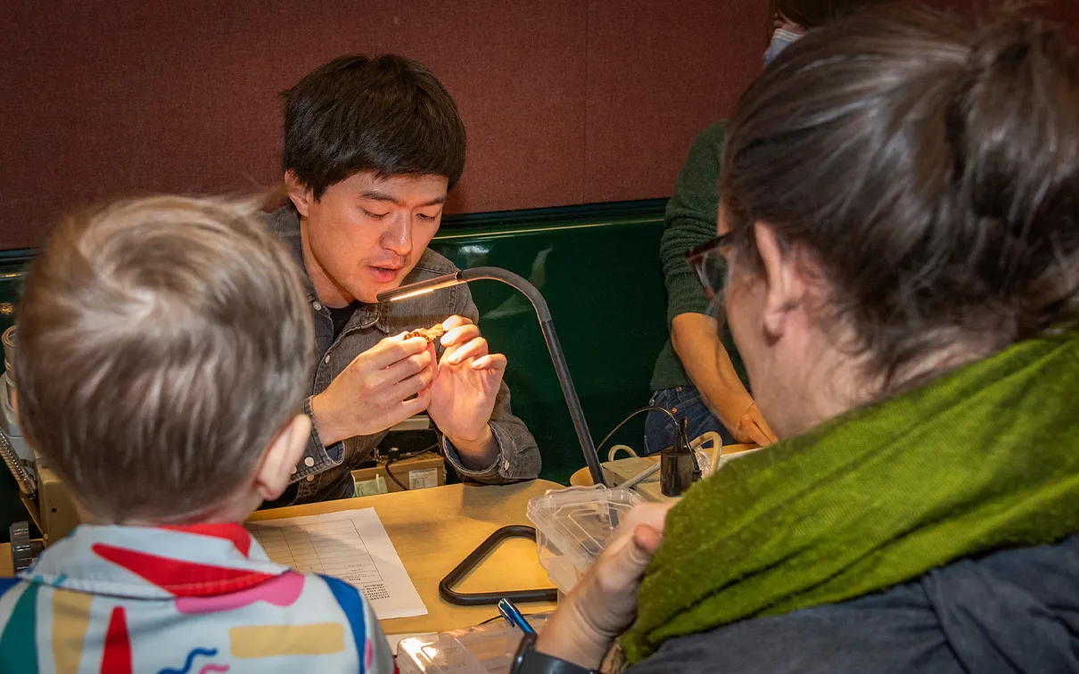 Professor educating students about rocks