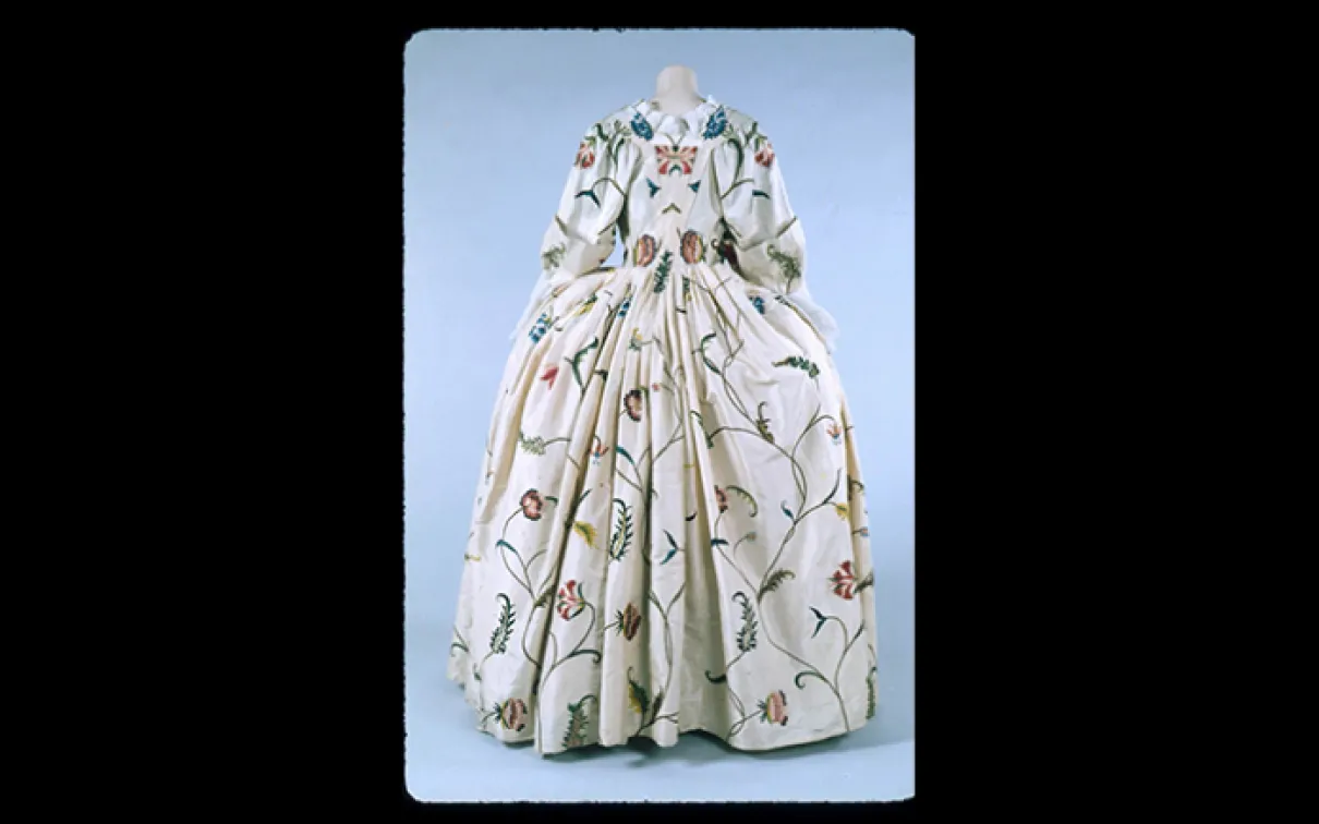 Women’s floral brocade dress with a large skirt and long sleeves, 1775–1777.