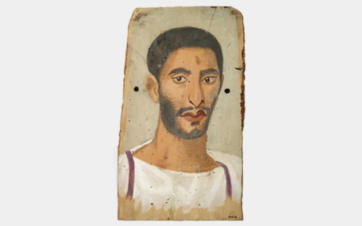 Portrait of a man with dark hair, beard, and mustache, wearing a white tunic with purple stripes on the edges.