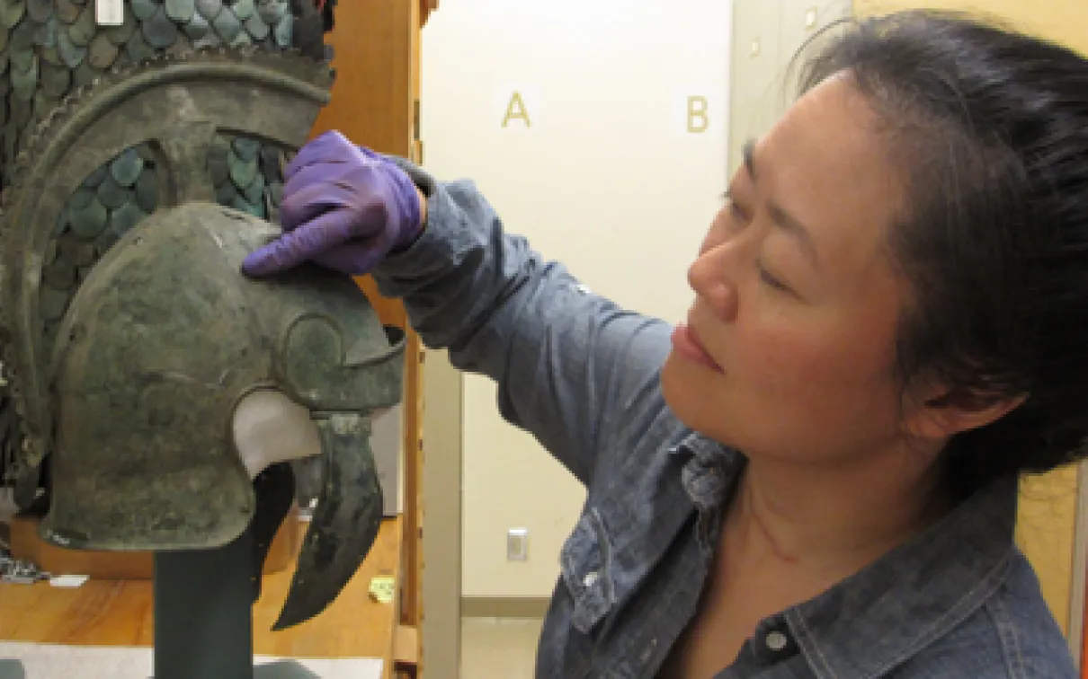 Examining a helmet for the Fact or Falsehood display
