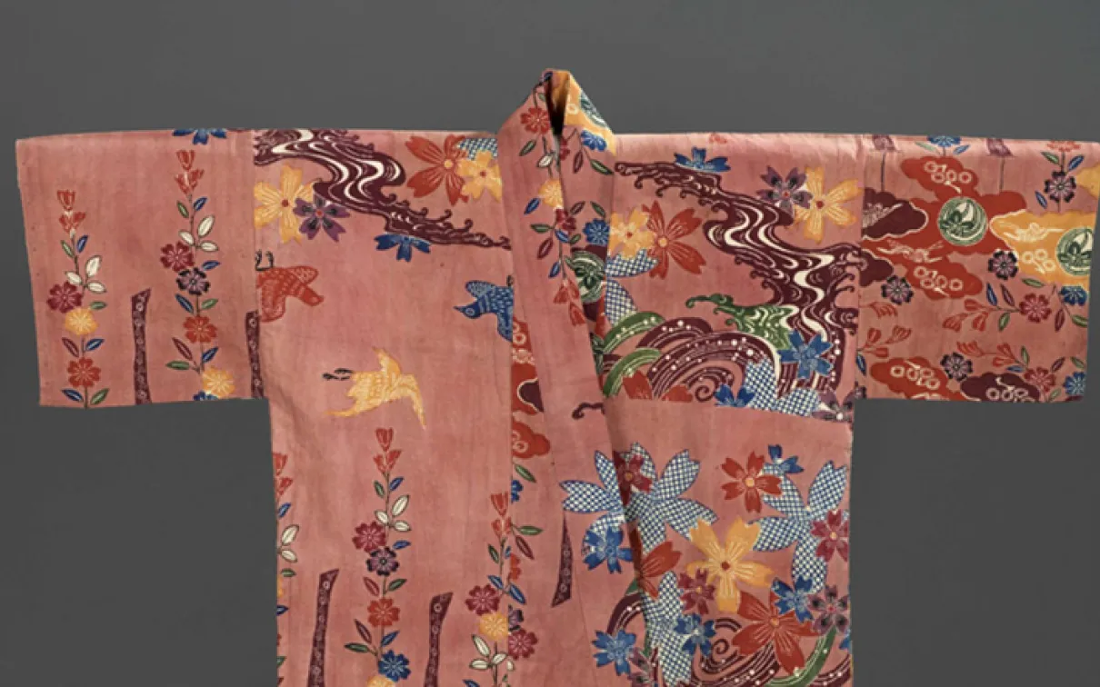Silk Chinese robe with embroidered floral and bird motifs on a pink background.