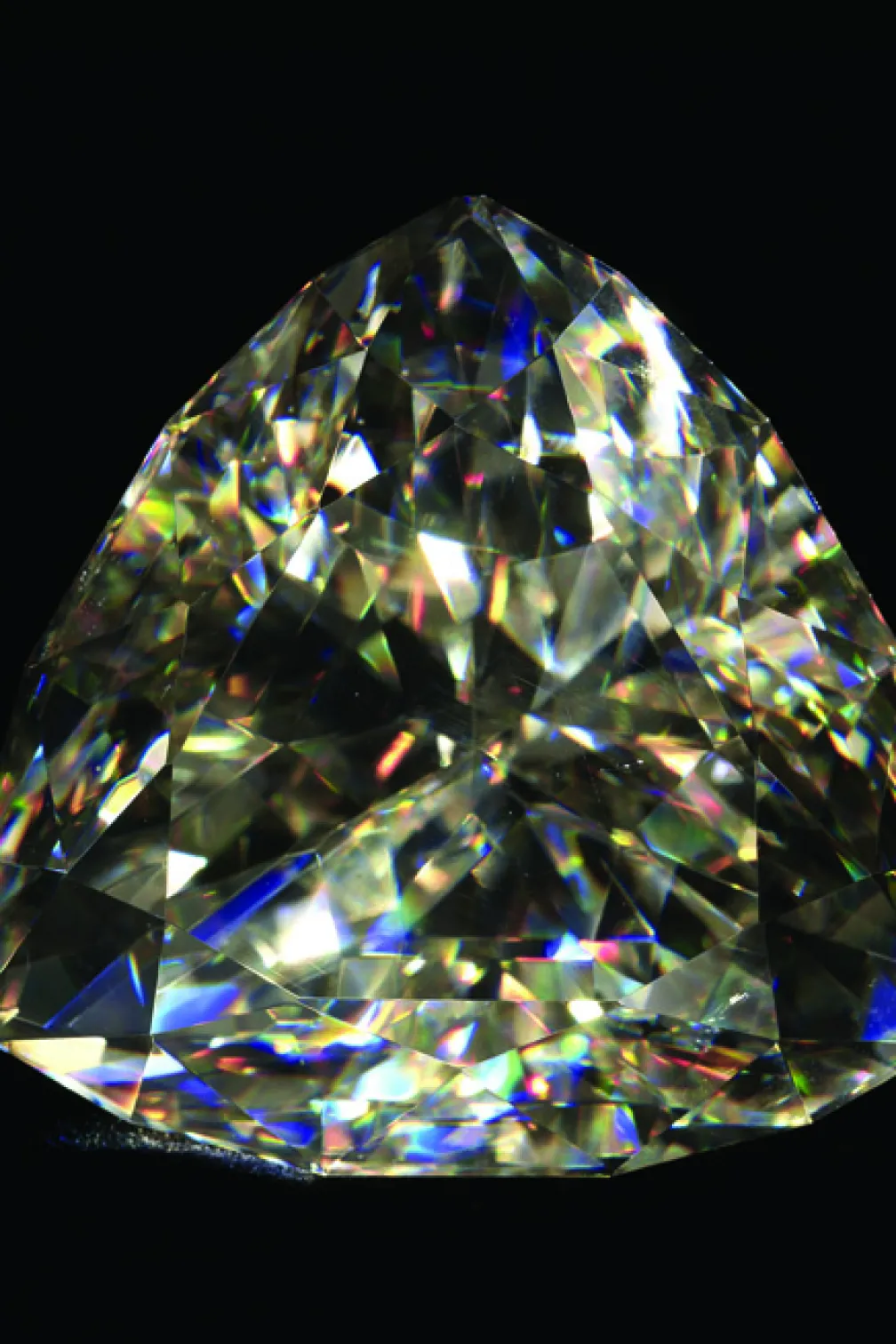 A diamond like gemstone on a black background
